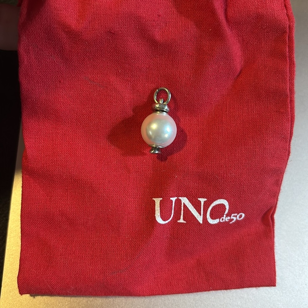 Authentic UNOde50 Sterling silver plated charm with white Pearl.